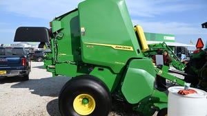 A green John Deere tractor on display