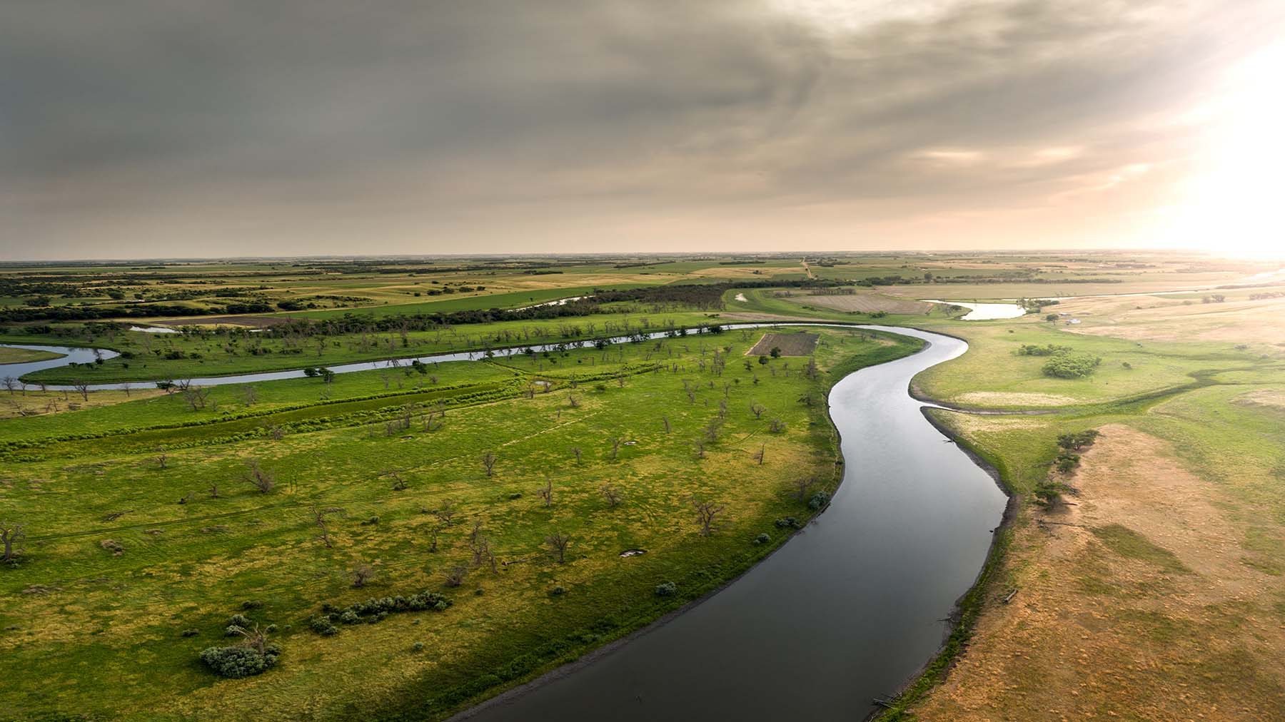 Winding river at sunset