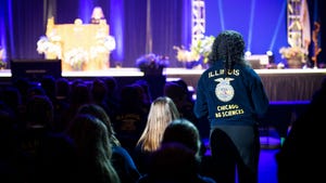 the back of Mariam Muhammed of Chicago High School for Ag Sciences FFA Chapter as she speaks at the Illinois FFA convention