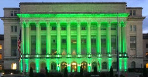 Green lights illuminate the USDA’s Jamie L. Whitten Building in Washington, DC on Sunday, April 18, 2021.