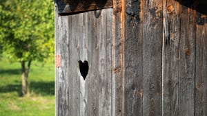 outhouse with heart cutout on the door