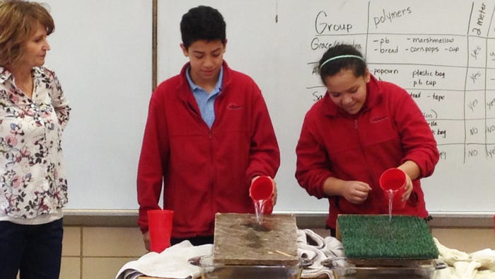 Students creating rain in experiment Students creating rain in experiment