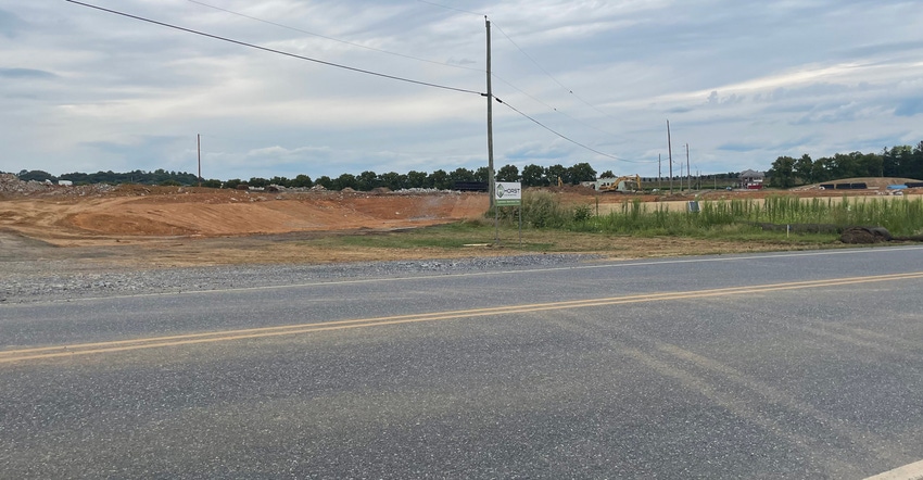 dirt mounds on a piece of land under construction dirt mounds on a piece of land under construction