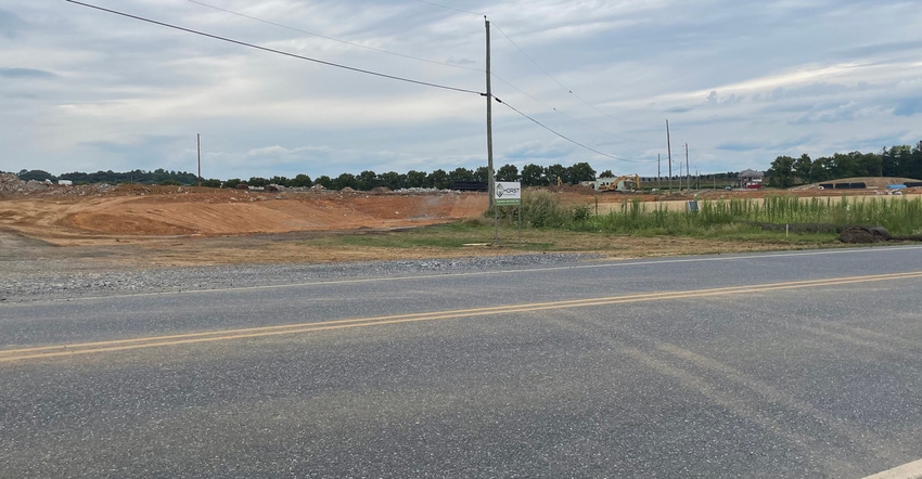 dirt mounds on a piece of land under construction