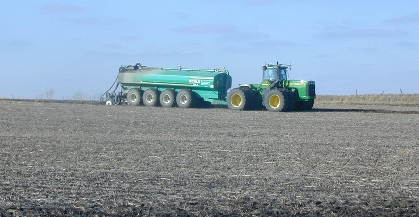 tractor applying manure application to field