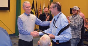 Purdue’s Jim Mintert shakes Howard Doster hand at the Purdue Top Farmer Workshop