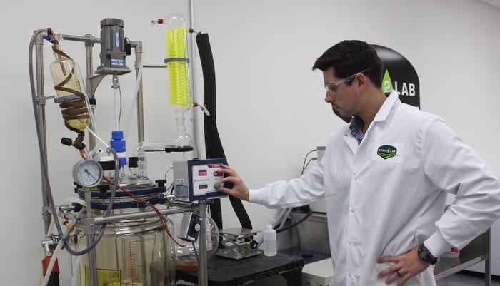 man adjusts equipment in laboratory