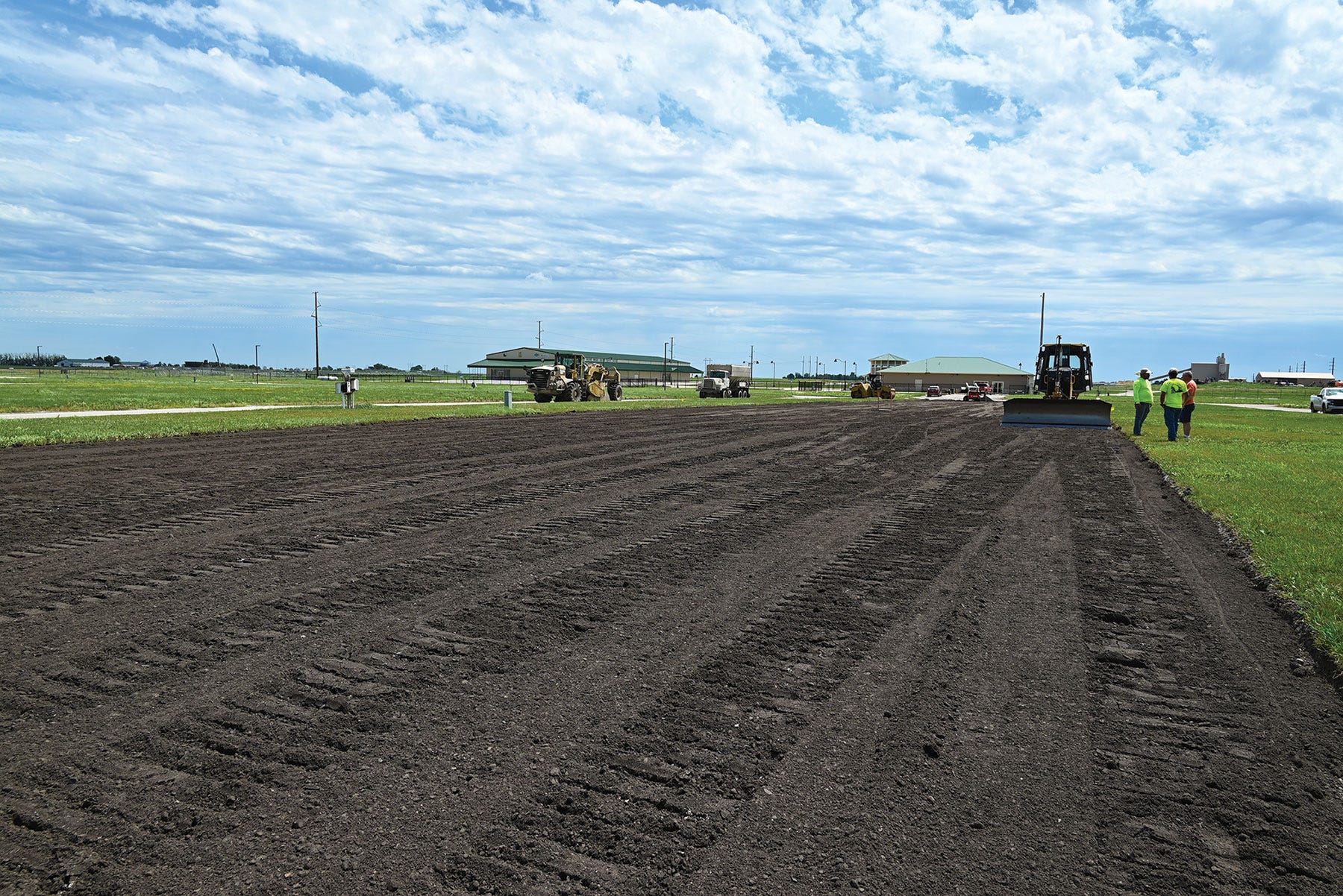 machinery spreading soy asphalt