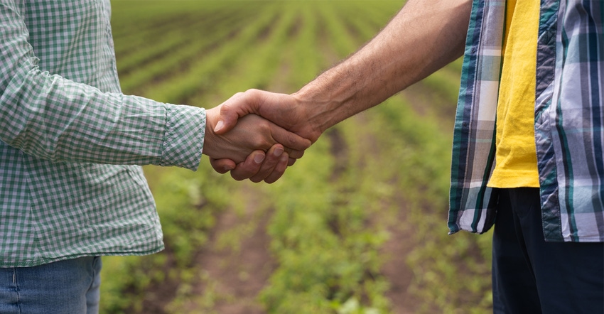 Two farmers shaking hands