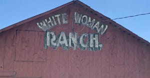 White Woman Ranch painted on a barn