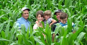David, Sarah, Audrey, Walker and Kaiden Fitch stand together in the middle of a corn field
