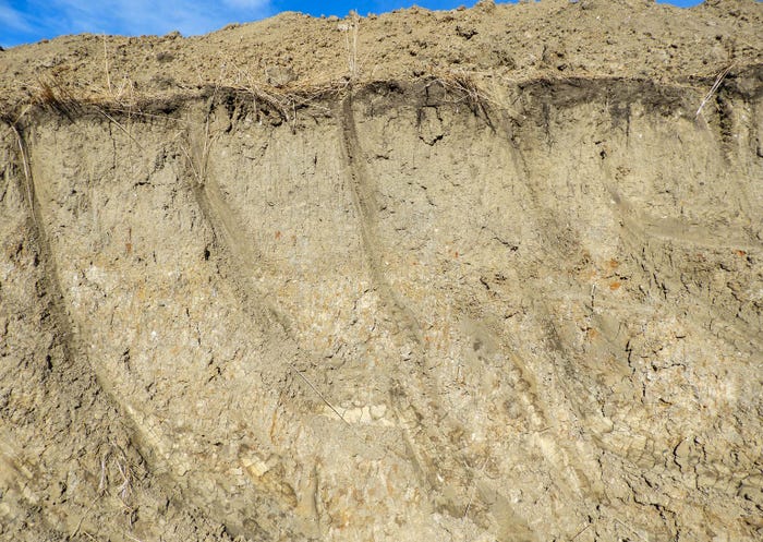 A close up of topsoil at the top of a hill
