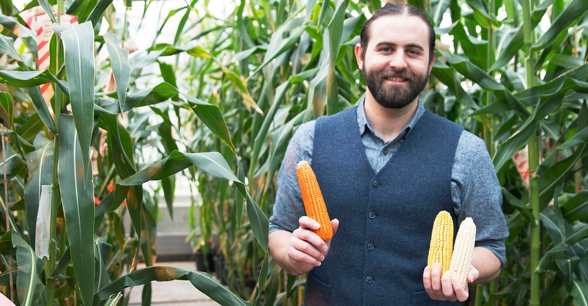 Evan Rocheford holds ears of corn