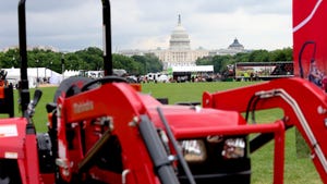 Overlooking Mahindra’s display of tractors on the National Mall
