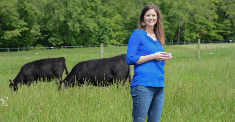 Kimberly Wolter with cattle in pasture