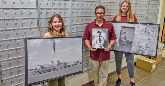 3 employees of U-MN Crookston hold framed images, part of 80+ photo exhibit: Roots of the Red River Valley 3 employees of U-MN Crookston hold framed images, part of 80+ photo exhibit: Roots of the Red River Valley