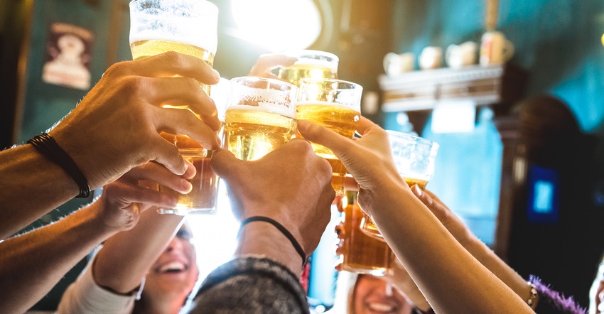 beer glasses raised in a toast