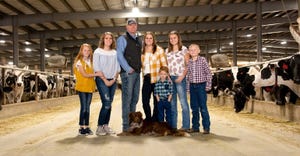 Webb family of Heglar Creek Dairy in Idaho standing in dairy barn