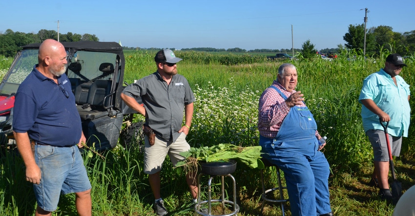 Roger Wenning, his son, Nick, Dave Brandt, seated, and Loran Steinlage