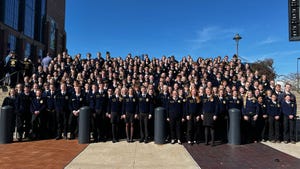 Large group of FFA members gather on stairs for group shot