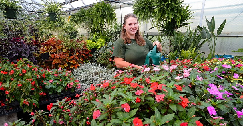 Heather Genrich at work in Genrich’s Garden Center and Greenhouses in Irondequoit, N.Y.