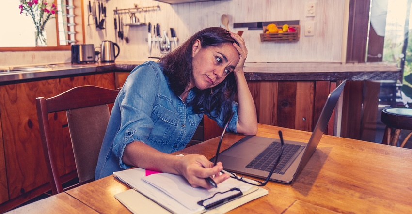 Stressed business woman working from home