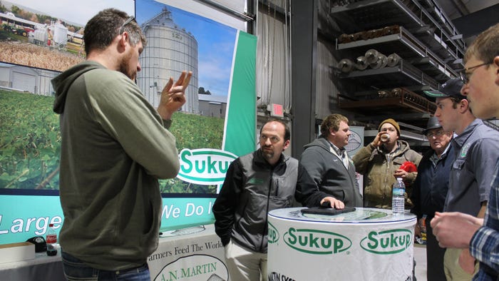 Lydell Martin (left) discusses grain systems with open house attendees