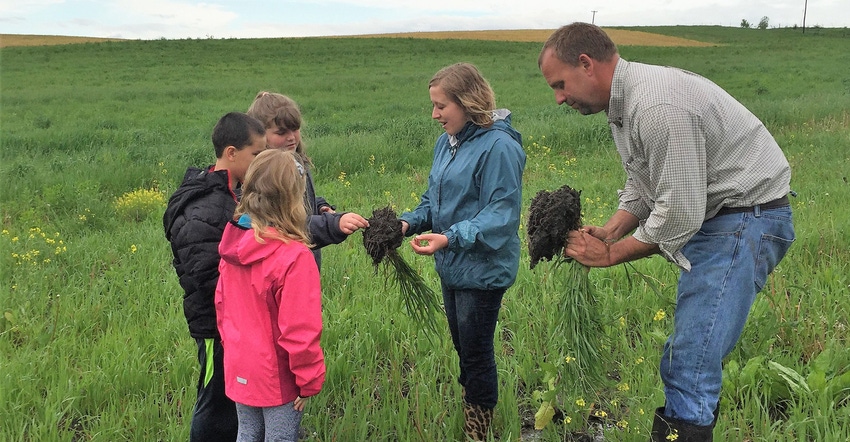 Southwest Iowa farmer Seth Watkins with young learners Southwest Iowa farmer Seth Watkins with young learners