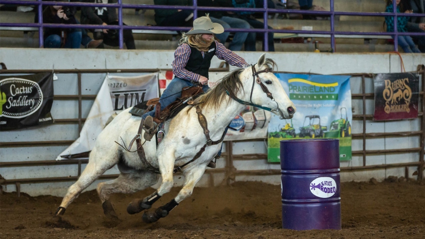 Women riding horse at rodeo