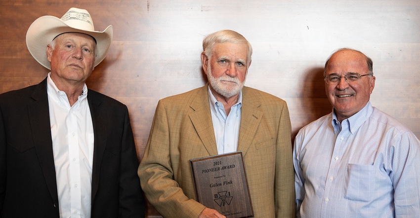 Galen Fink, Randolph, Kan., receives the Beef Improvement Federation Pioneer Award from Joe Mushrush , 2020-21 BIF president,