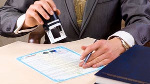 A close up of a lawyer stamping a document with a notary seal