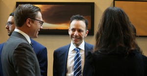 Jeff Wolf, Heat Biologics’ chief executive officer talks with dignitaries at the April 18 announcement of the new Scorpion 