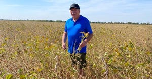 Farmer Roger Denhart stands in soybean field in Ukraine