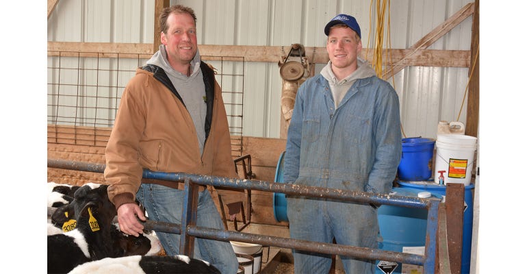 Kor Mulder and his son, Kelsey on Minnesota dairy farm