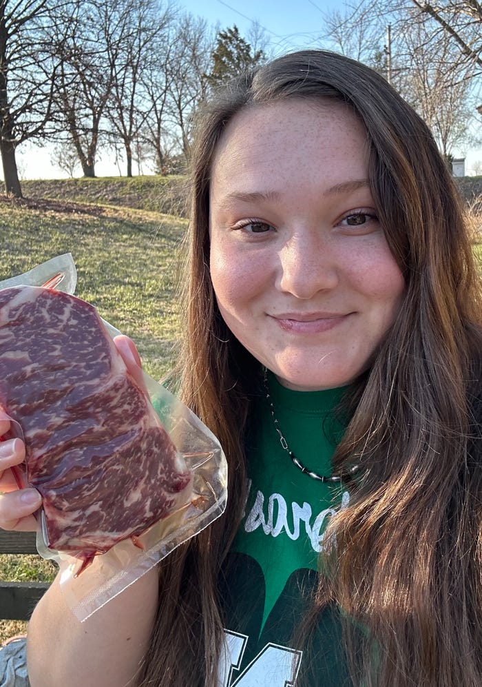 Elizabeth Hodges holding steak with meat thermometer