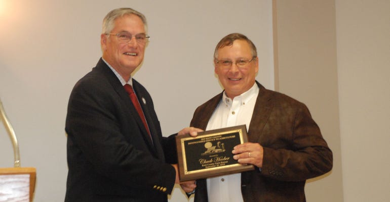Rep. Charles Postles presents Kent County Farm Bureau's Distinguished Service to Agriculture Award to Chuck Hoober