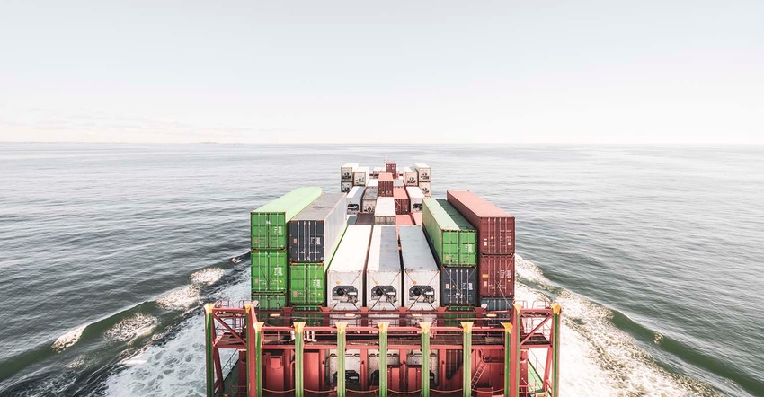 Barge on open water with shipping containers Barge on open water with shipping containers