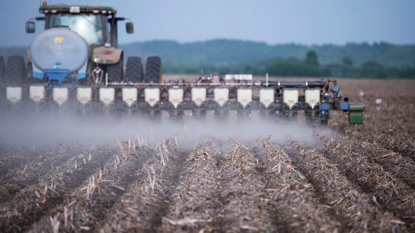 Tractor and planter planting corn into corn stubble no-till field