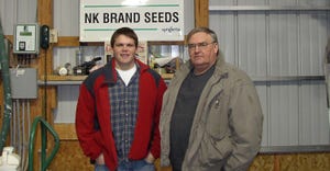Seth Sheehan standing in farm shop with his father, the late Tom Sheehan
