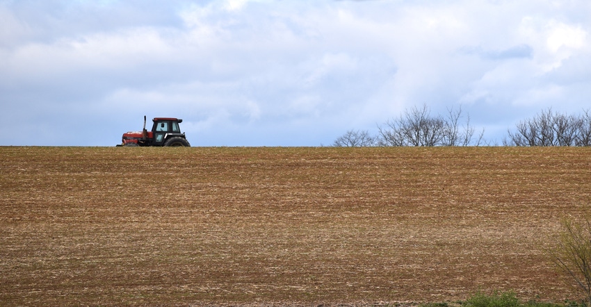 tractor driving across field