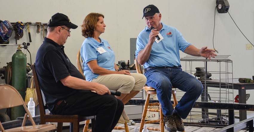 Jim and Kay Douglas and Michael Langemeier, Purdue Univ. Extension ag economist, talk with farmers