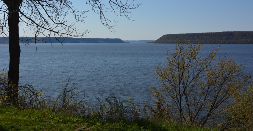 Landscape of a lake with a tree line in the distance