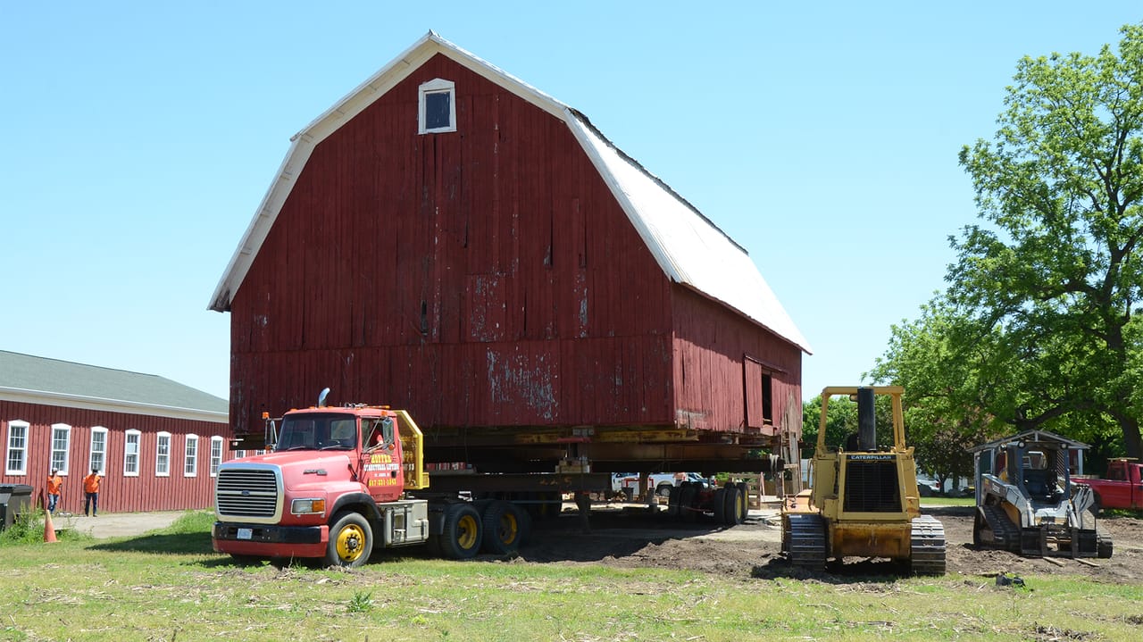 Moving day: 100-year-old barn rolls to new home