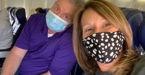 Mindy Ward and her husband wearing face masks while on an airplane