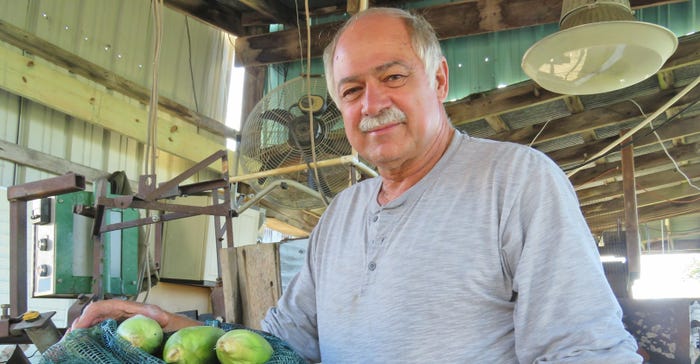 Bill Ingersoll with ears of sweet corn Bill Ingersoll with ears of sweet corn