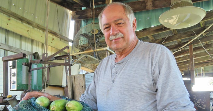 Bill Ingersoll with ears of sweet corn