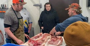 Rob Isaacson and Josh Holm welcome Leann Pietrzak and her students for a demonstration and tour of Backroad Meats