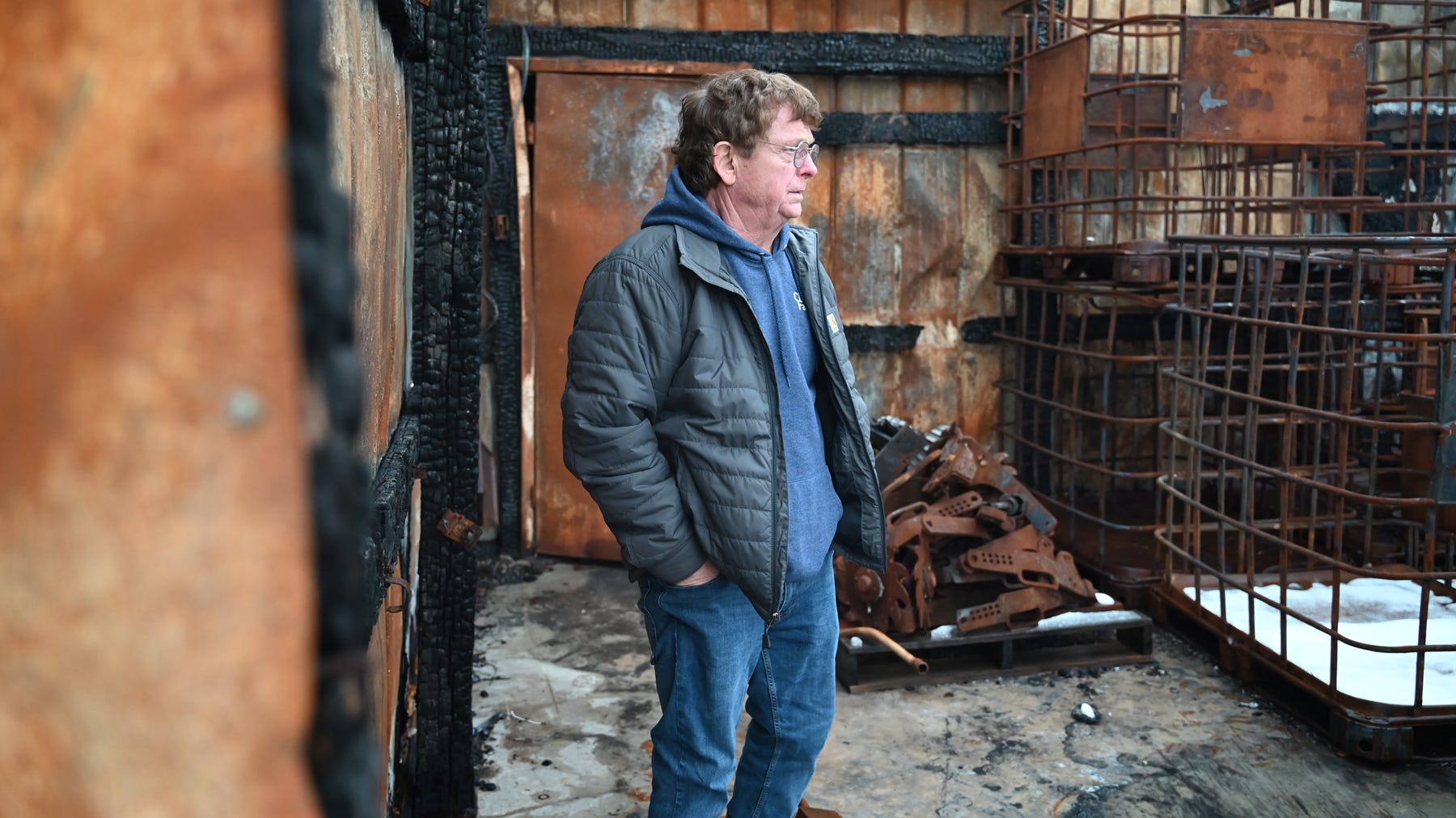Martin Barbre inside burned out farm shop