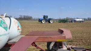 Tractor and equipment applying anhydrous to cropfield