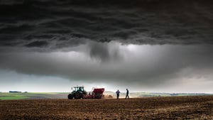 farmers in stormy field
